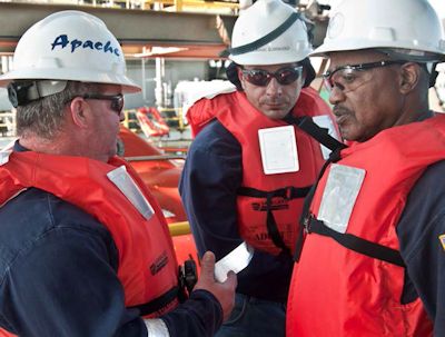 Three offshore workers meeting