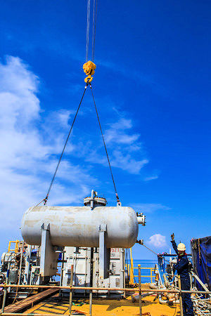 hoisting operations crane lifting large tank